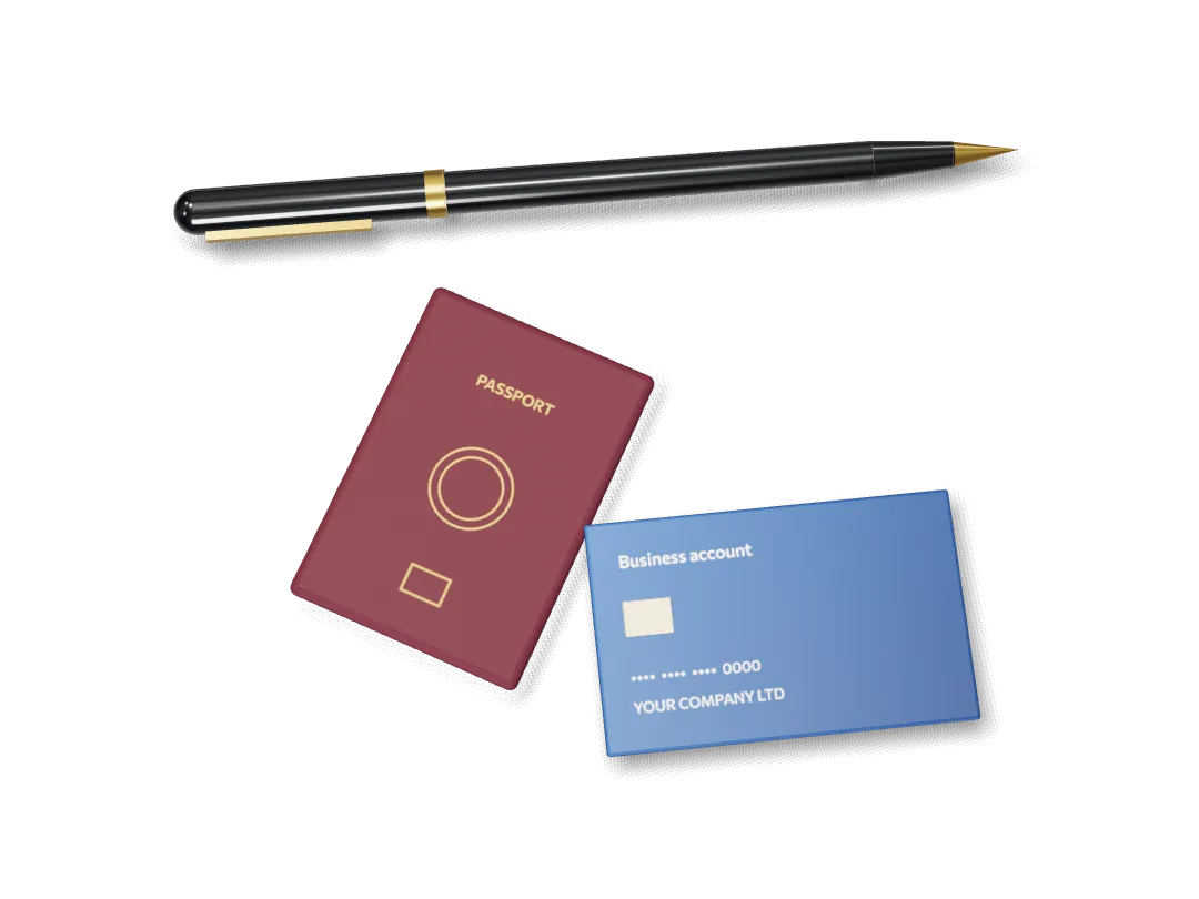A business bank card, a passport and a pen on a desk.